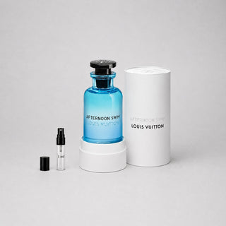 Louis Vuitton Afternoon Swim Sample Spray features a blue glass bottle and a small spray vial, presented in a white box.