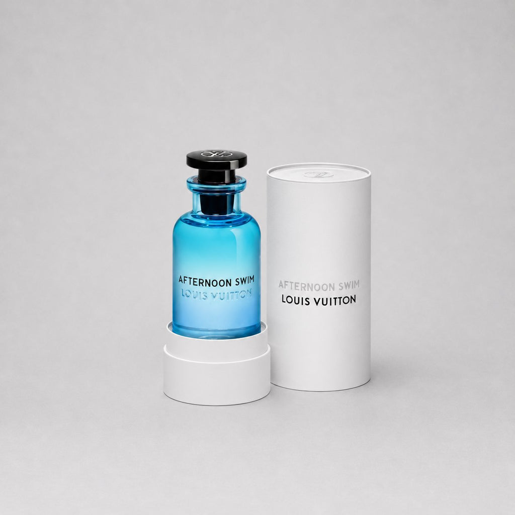 Louis Vuitton Afternoon Swim Sample Spray in a blue glass bottle, displayed with its white cylindrical box.