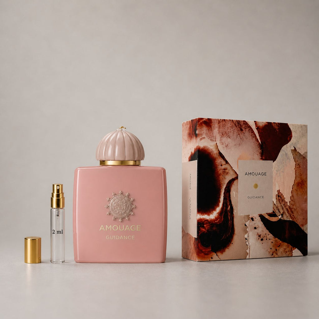 Amouage Guidance Sample Spray features a pink bottle with a decorative cap and a 2 ml spray vial, presented in a stylish box.