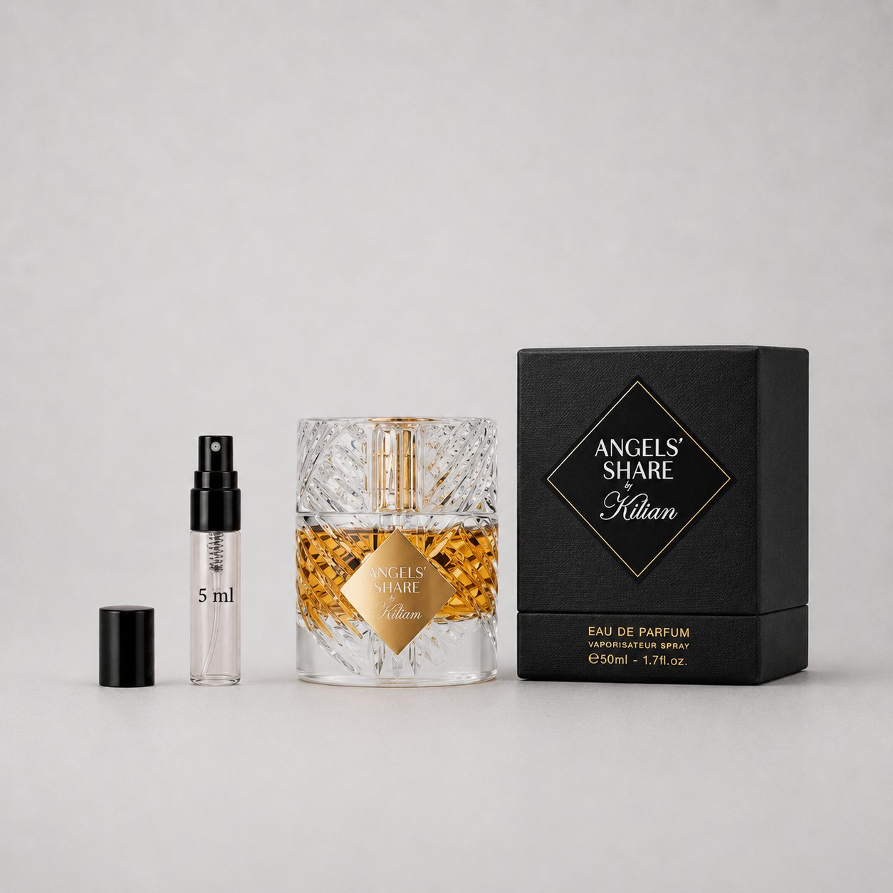 Kilian Angels' Share Sample Spray with a 5ml vial and a crystal bottle in a black box, showcasing luxury fragrance.