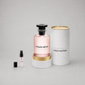 Louis Vuitton Attrape-Rêves Sample Spray features a pink glass bottle with a black cap, displayed beside a smaller spray vial