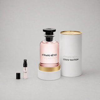 Louis Vuitton Attrape-Rêves Sample Spray features a pink glass bottle with a black cap, displayed beside a smaller spray vial