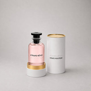 Louis Vuitton Attrape-Rêves Sample Spray in a clear bottle with pink liquid, displayed with a white cylindrical box.