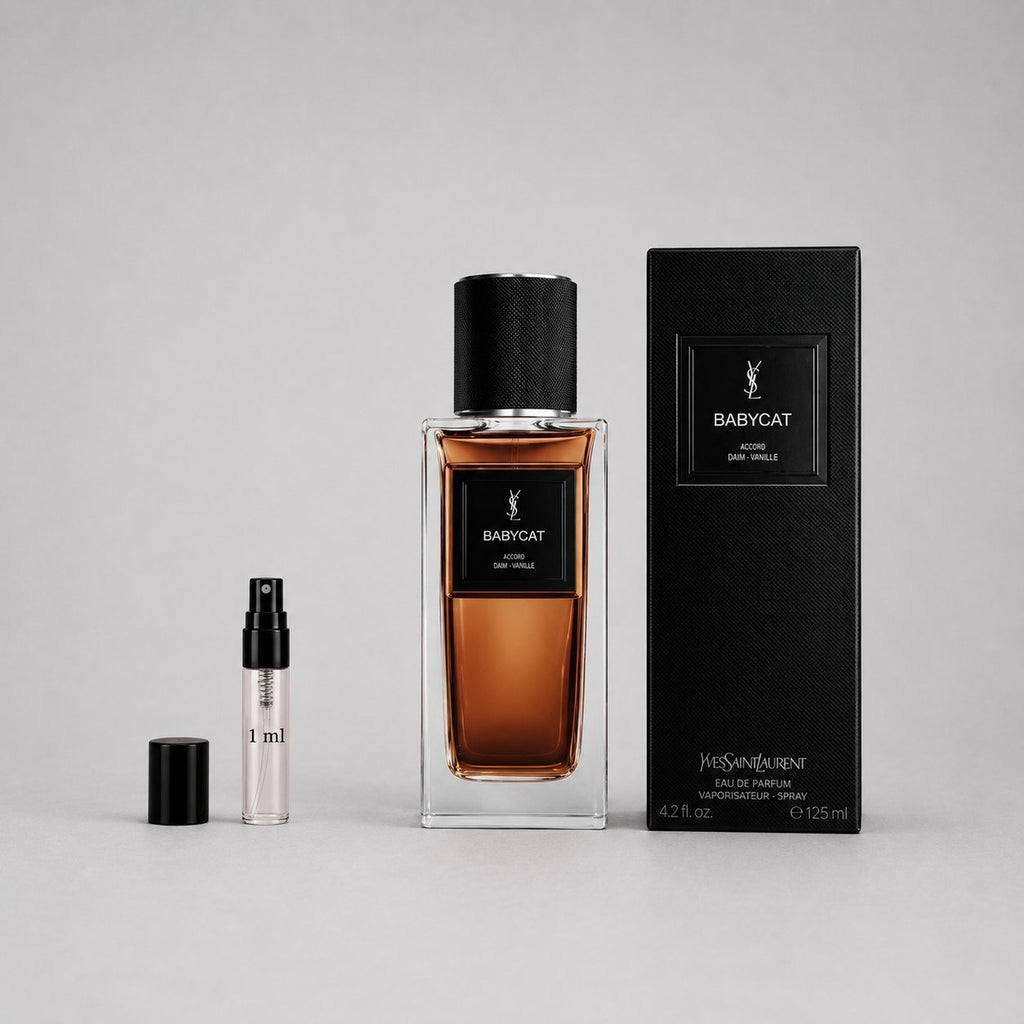 Yves Saint Laurent Babycat Sample Spray includes a 4.2 oz perfume bottle and a 1 ml travel spray, both in elegant packaging.