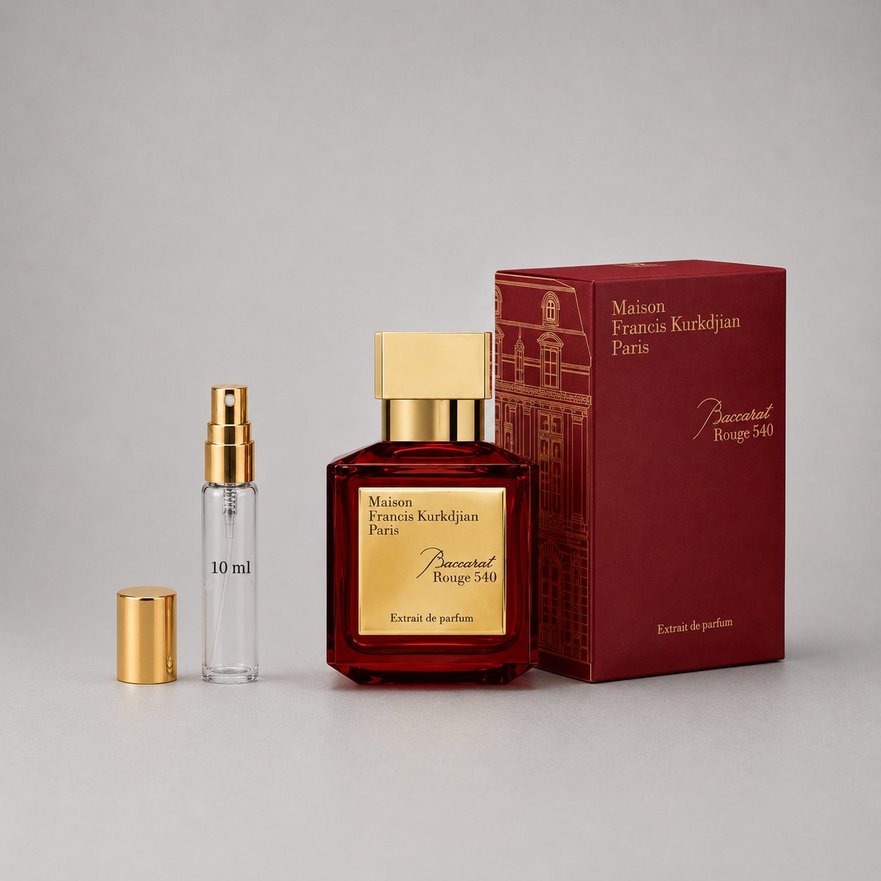 Maison Francis Kurkdjian Baccarat Rouge 540 Sample Spray, featuring a red glass bottle, gold accents, and a matching box.