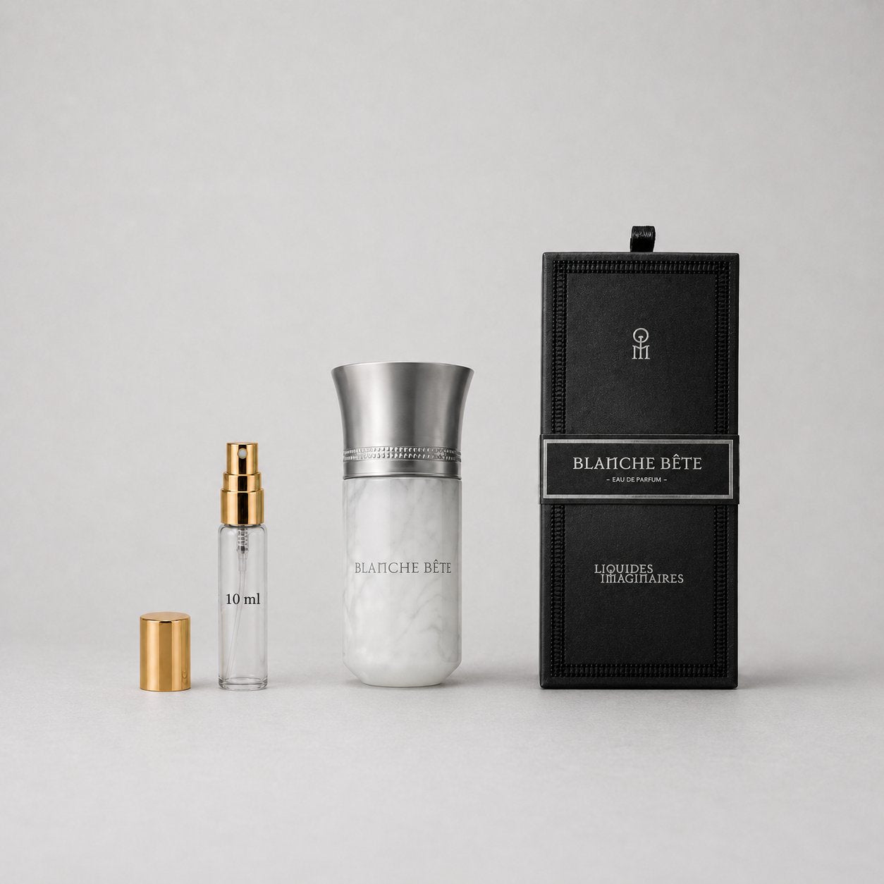 Liquides Imaginaires Blanche Bête Sample Spray includes a 10ml spray vial and a marble-patterned bottle in a black box.