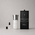 Liquides Imaginaires Blanche Bête Sample Spray featuring a sleek bottle and a small spray vial, presented in a black box.