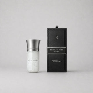 Blanche Bête Sample Spray by Liquides Imaginaires in a sleek, silver and white bottle next to a black box with a label.