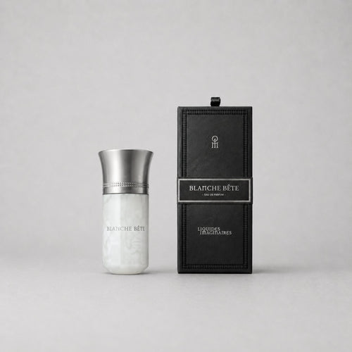 Blanche Bête Sample Spray by Liquides Imaginaires in a sleek, silver and white bottle next to a black box with a label.