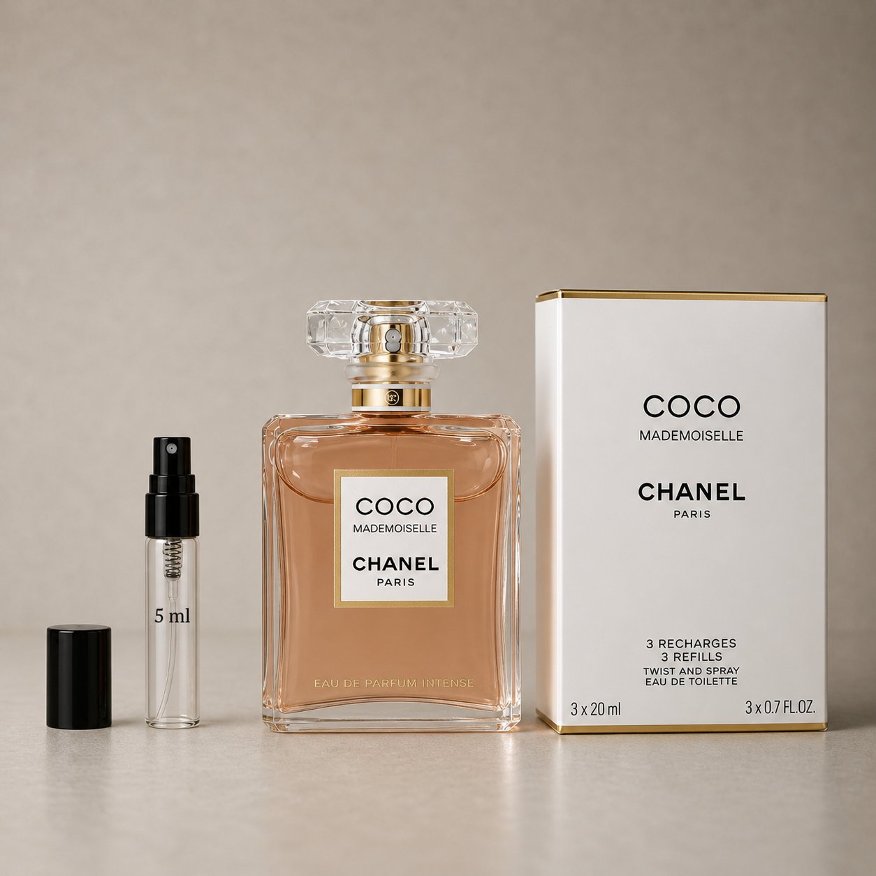 Chanel Coco Mademoiselle Sample Spray set featuring a 20ml bottle and three 5ml refill sprays in a sleek box.