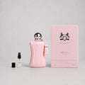 Delina Sample Spray by Parfums de Marly, featuring a pink bottle, tassel, and a small spray vial beside the box.