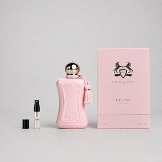 Delina Sample Spray by Parfums de Marly, featuring a pink bottle, tassel, and a small spray vial beside the box.