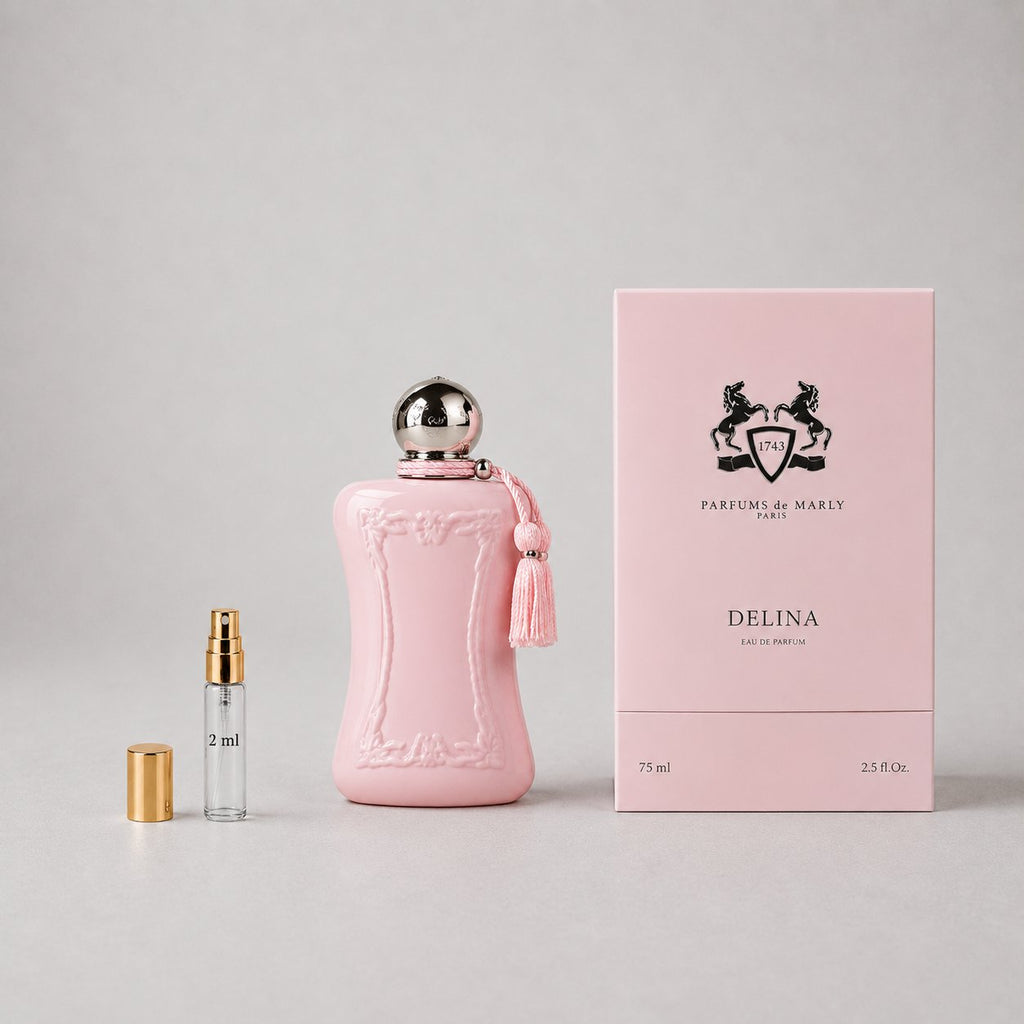 Delina Sample Spray by Parfums de Marly features a pink bottle with a tassel, alongside a 2 ml sample vial and elegant packag