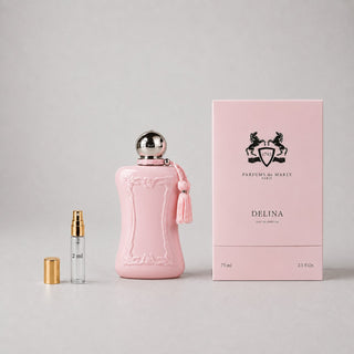 Delina Sample Spray by Parfums de Marly features a pink bottle with a tassel, alongside a 2 ml sample vial and elegant packag