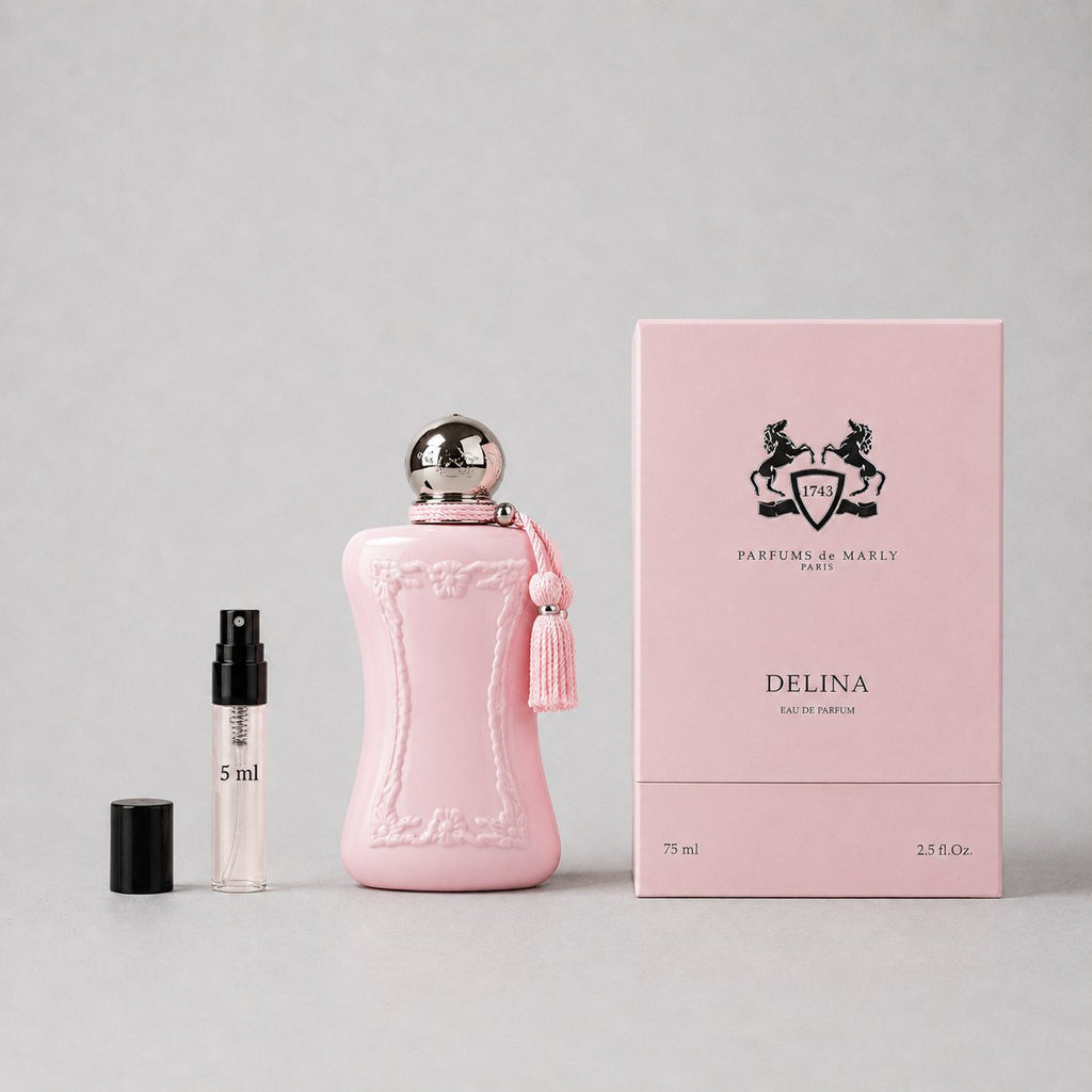 Delina Sample Spray by Parfums de Marly, featuring a pink bottle, tassel, and a 5ml spray vial beside a pink box.