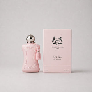 Delina Sample Spray by Parfums de Marly in a pink bottle with a tassel, next to a matching pink box. 75 ml.