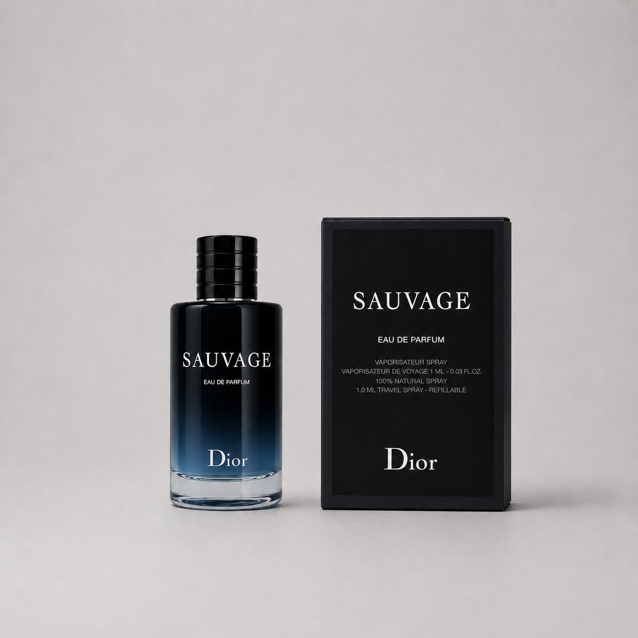 Dior Sauvage Eau de Parfum sample spray in a sleek bottle next to its black box packaging, featuring elegant branding.