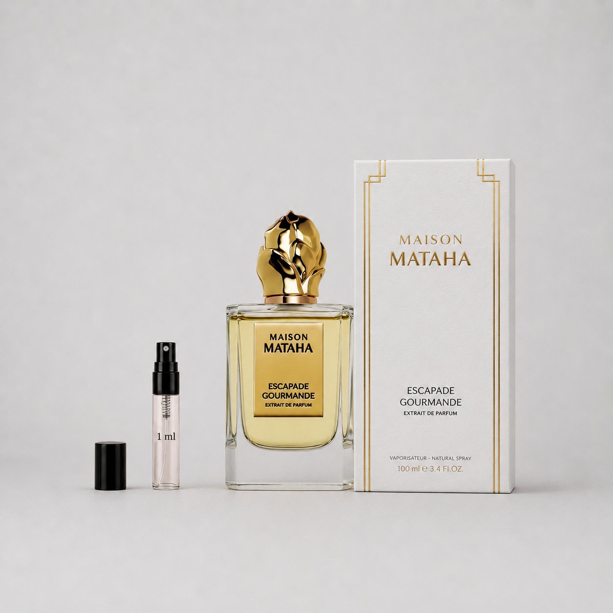 Maison Mataha Escapade Gourmande Sample Spray features a 100ml perfume bottle with a gold cap and a 1ml travel spray.