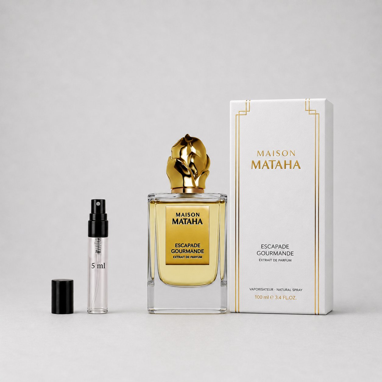 Maison Mataha Escapade Gourmande Sample Spray includes a 100 ml bottle and a 5 ml travel spray, both elegantly designed.