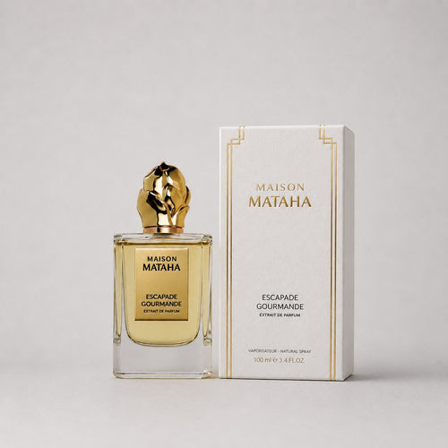 Maison Mataha Escapade Gourmande Sample Spray features a gold-capped bottle with a sleek design, accompanied by a stylish box