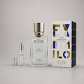 Ex Nihilo Fleur Narcotique Sample Spray with a clear bottle, silver cap, and elegant packaging in blue and gold.