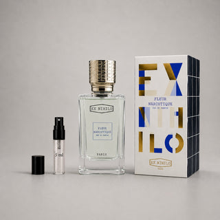 Ex Nihilo Fleur Narcotique Sample Spray featuring a clear bottle with a gold cap, a 5 ml spray vial, and a decorative box.