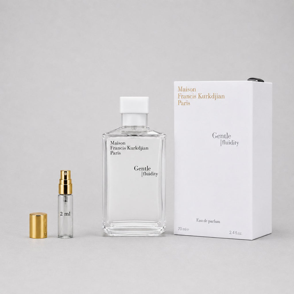 Maison Francis Kurkdjian Gentle Fluidity Silver Sample Spray with a 2ml vial and elegant packaging on a gray background.