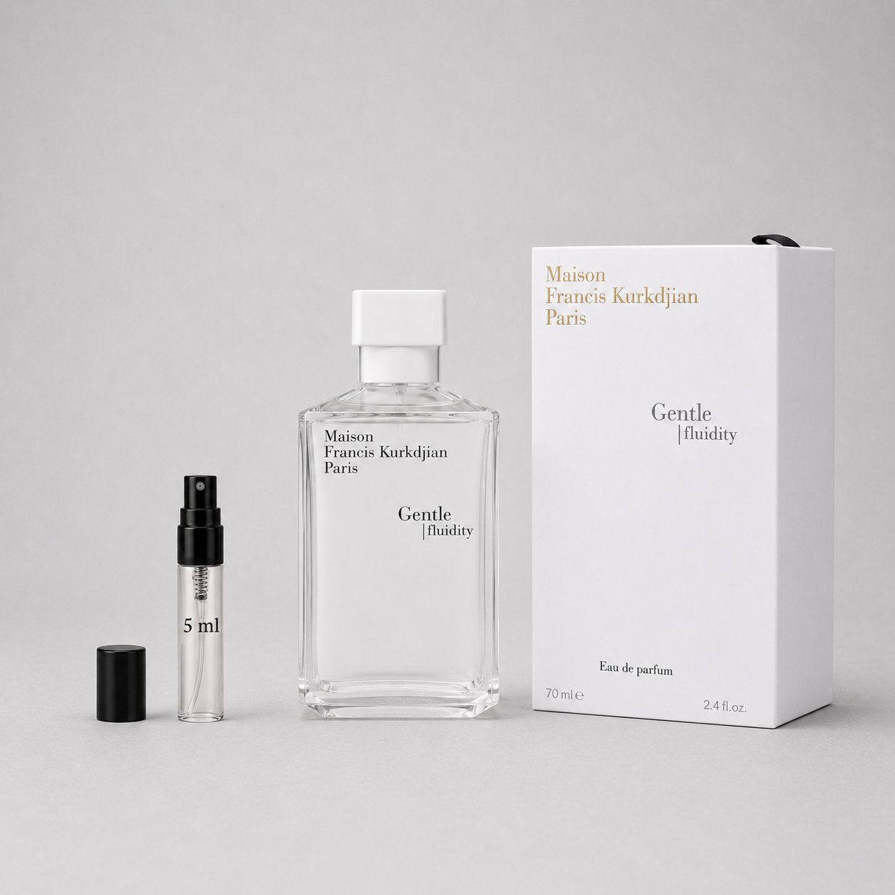 Maison Francis Kurkdjian Gentle Fluidity Silver Sample Spray with a 70ml bottle and a 5ml travel spray, elegantly packaged.
