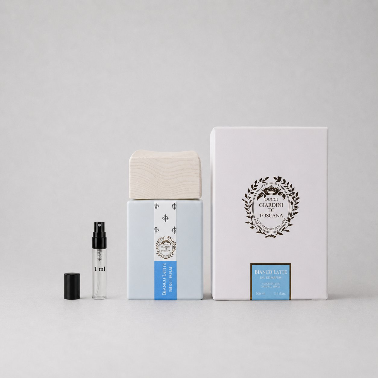 Giardini di Toscana Bianco Latte Sample Spray with a blue box, wooden cap, and a small spray vial.
