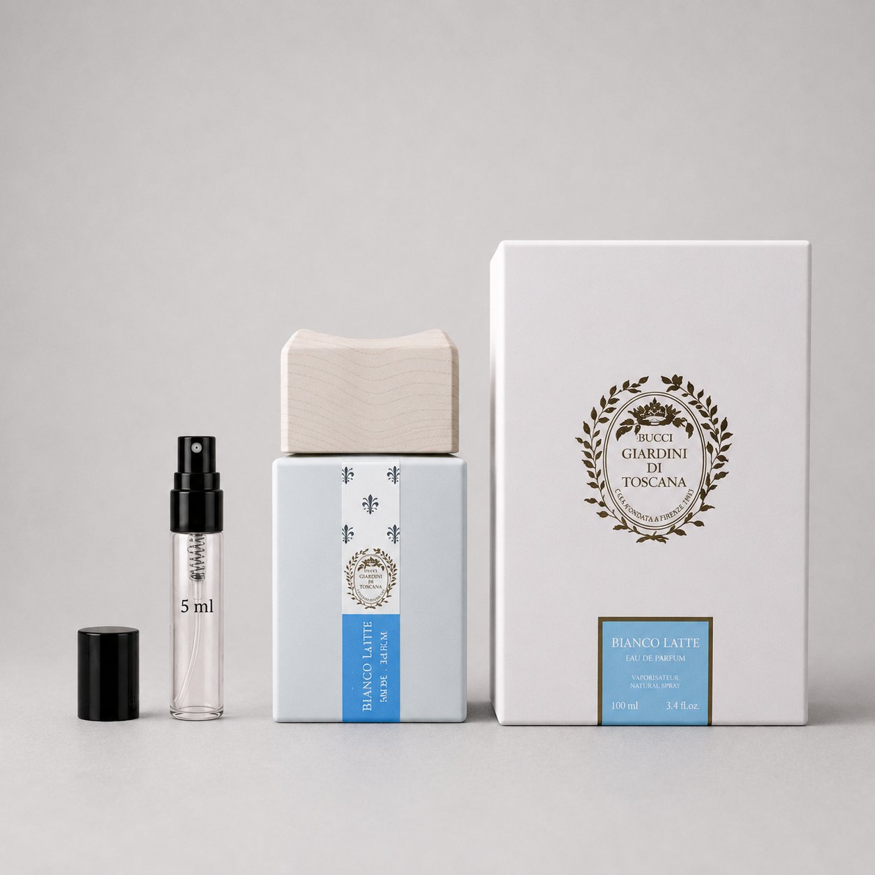 Giardini di Toscana Bianco Latte Sample Spray with a clear vial, wooden cap, and elegant packaging box.