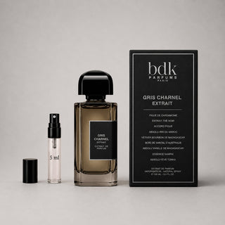 BDK Parfums Gris Charnel sample spray and full-size bottle with elegant black packaging, showcasing a sophisticated fragrance
