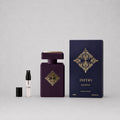 Initio Parfums Privés Side Effect Sample Spray, featuring a dark purple bottle and elegant packaging with gold accents.