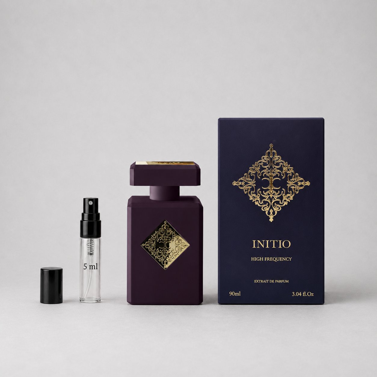 Initio Parfums Privés Side Effect Sample Spray includes a dark purple bottle with a decorative gold label and a matching box.