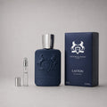 Parfums de Marly Layton Sample Spray, featuring a dark blue bottle, silver cap, and matching box with a 3ml spray vial.