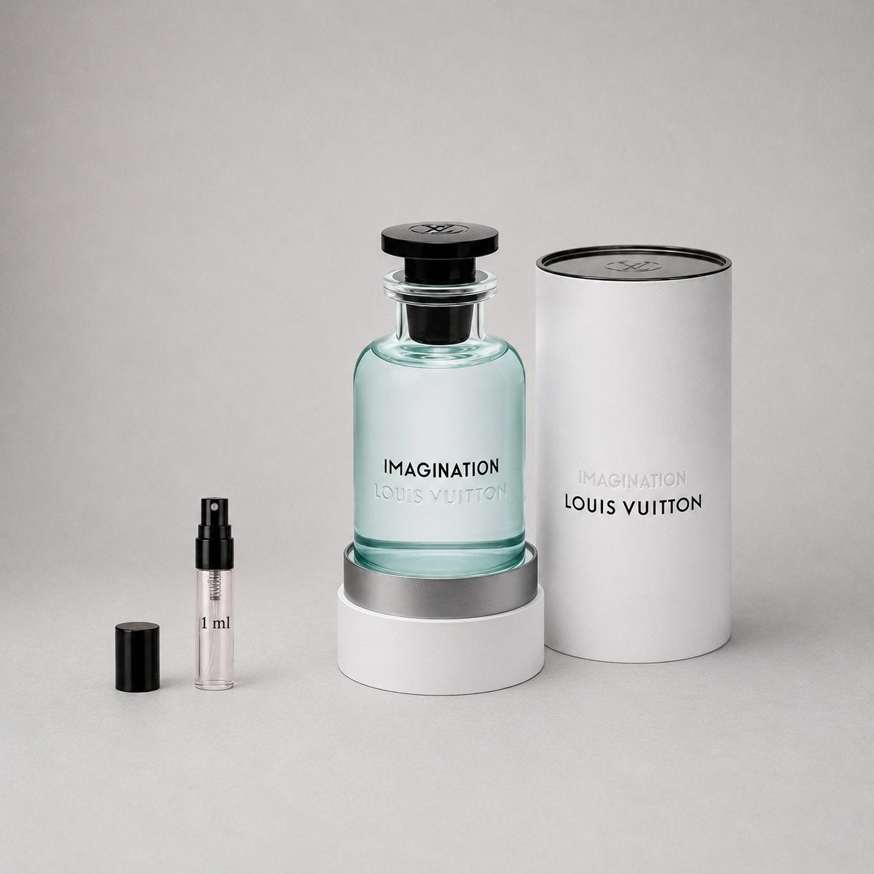 Louis Vuitton Imagination Sample Spray featuring a clear bottle with a black cap and a white cylindrical box.