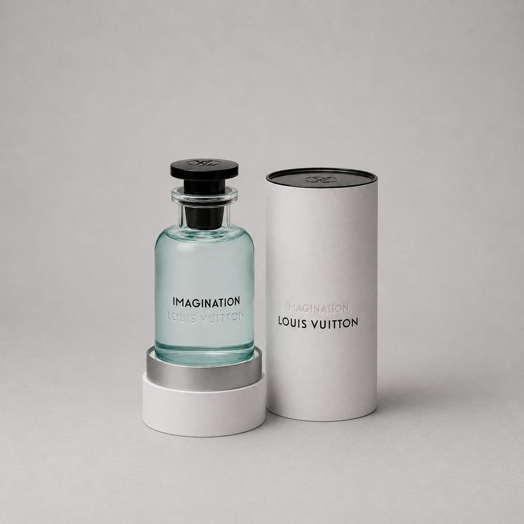 Louis Vuitton Imagination Sample Spray in a clear glass bottle with a black cap, presented in a white cylindrical box.