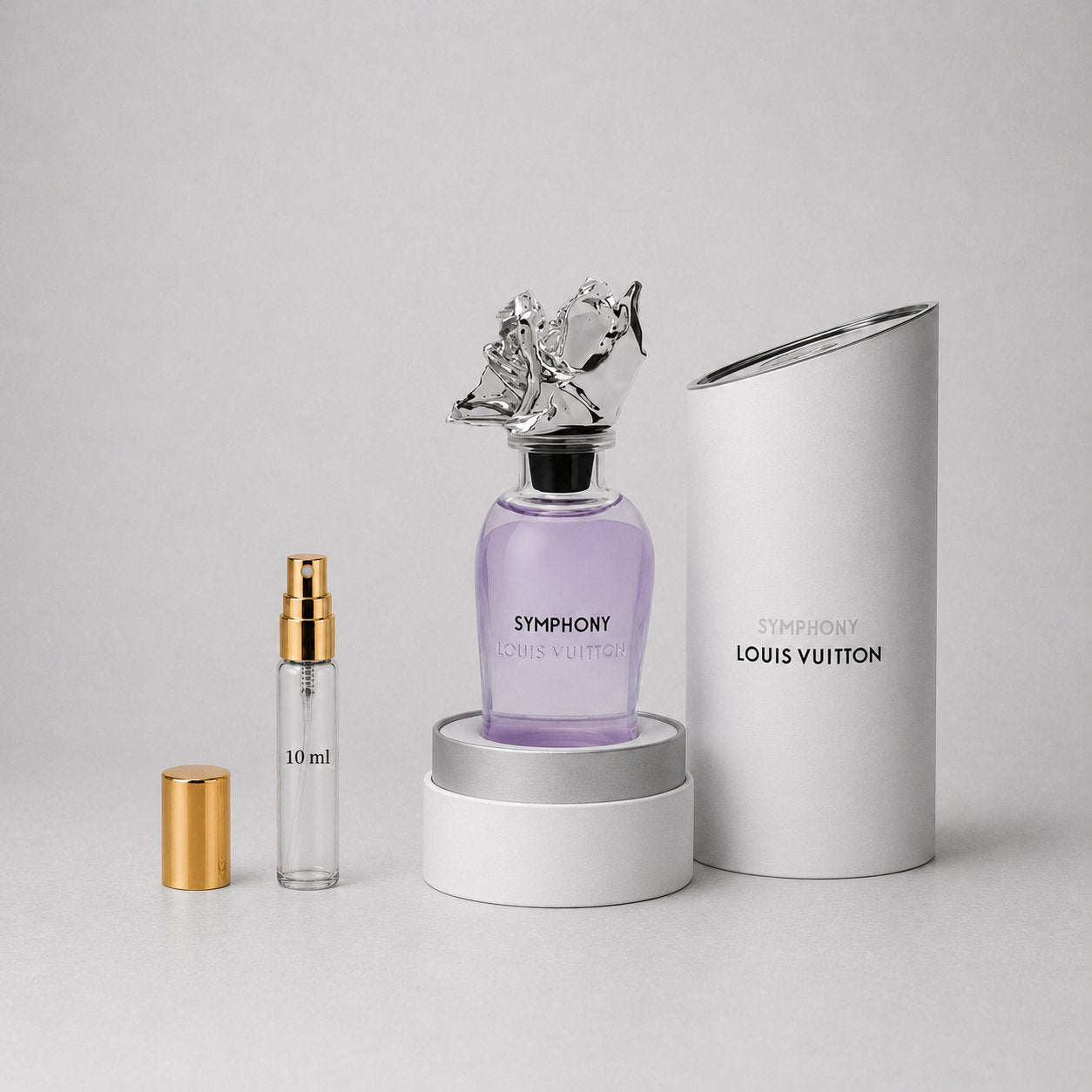 Louis Vuitton Symphony Sample Spray featuring a purple bottle with a decorative cap, alongside a 10 ml spray and a cylindrica