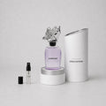 Louis Vuitton Symphony Sample Spray featuring a purple bottle with a decorative cap, alongside a 1 ml spray vial and a cylind