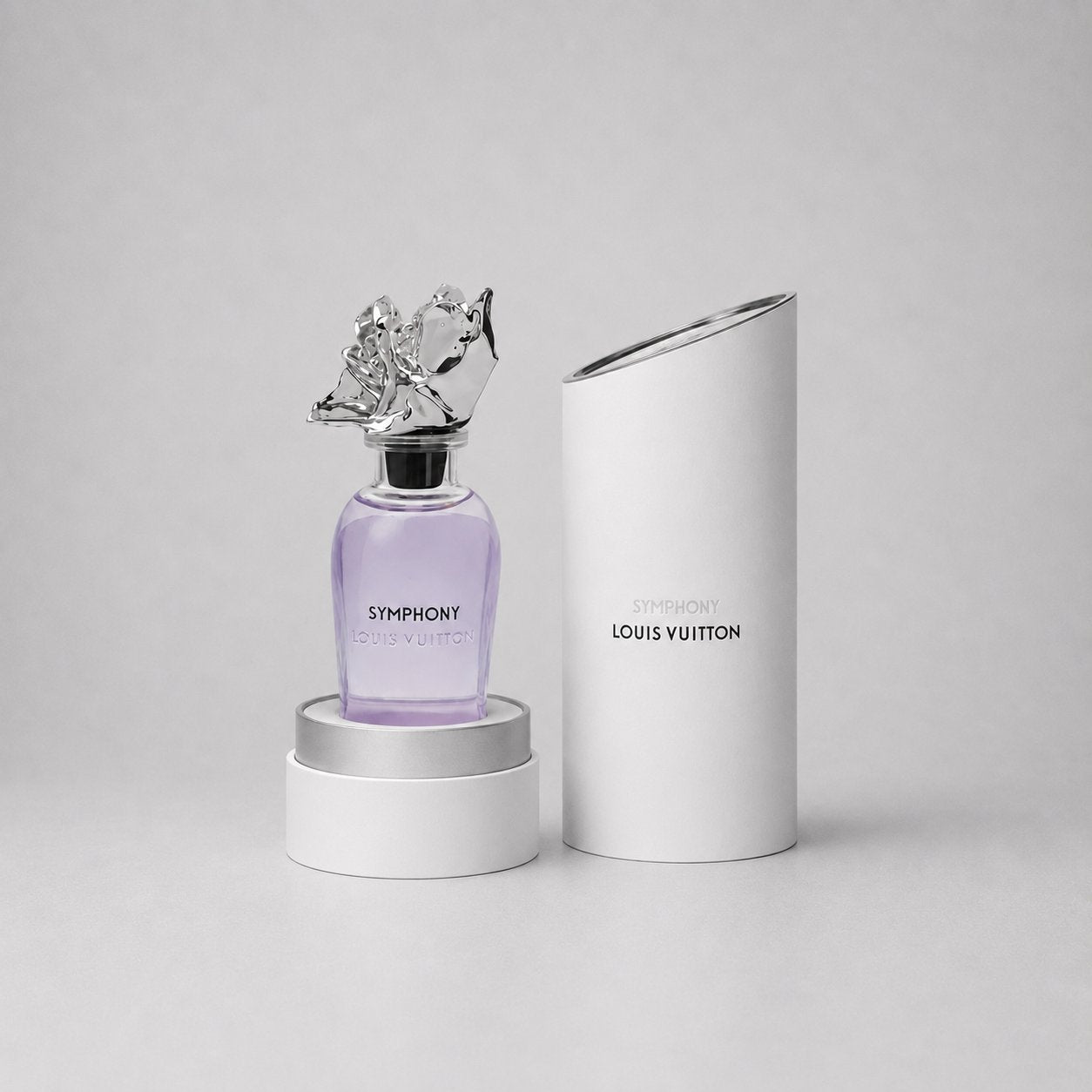 Louis Vuitton Symphony Sample Spray in a purple bottle with a decorative cap, displayed with its elegant packaging.
