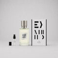 Ex Nihilo The Hedonist Sample Spray featuring a clear bottle with a textured silver cap, a small vial, and a stylish box.