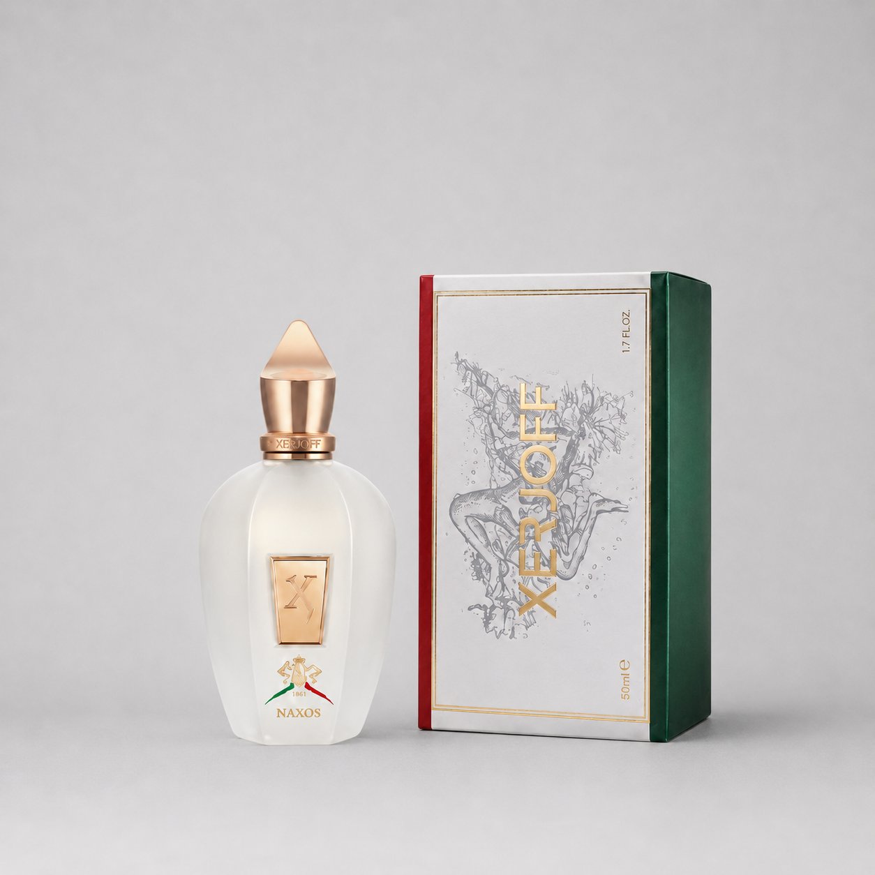 Xerjoff Naxos Sample Spray in a clear bottle with a gold cap, next to a decorative green and red box.